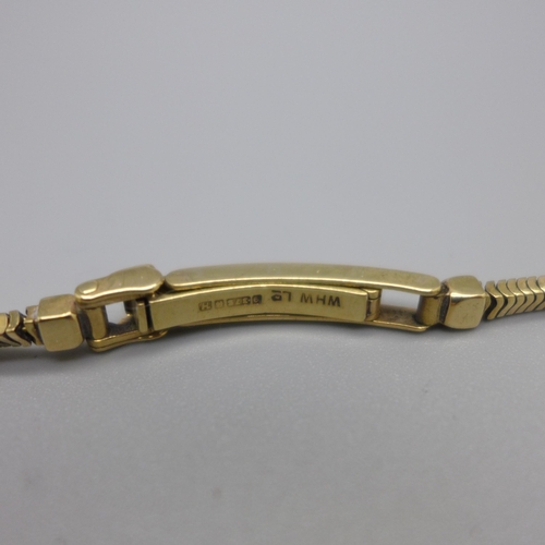 1130 - A lady's 9ct gold Buren wristwatch on a 9ct gold bracelet strap, London 1923, total weight with move... 