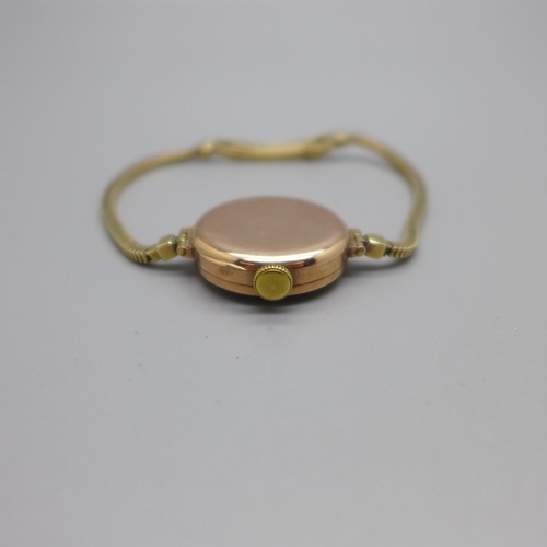 1130 - A lady's 9ct gold Buren wristwatch on a 9ct gold bracelet strap, London 1923, total weight with move... 