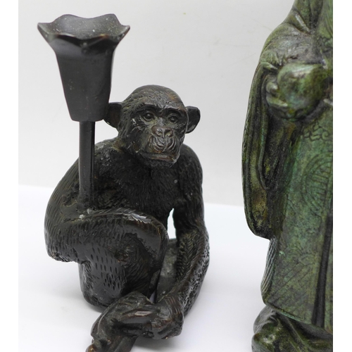 625 - A Chinese bronze figure of a sage and a bronze monkey candlestick, figure 22cm