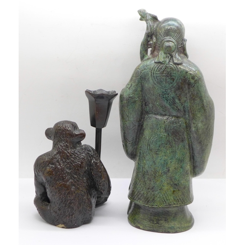 625 - A Chinese bronze figure of a sage and a bronze monkey candlestick, figure 22cm