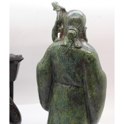 625 - A Chinese bronze figure of a sage and a bronze monkey candlestick, figure 22cm