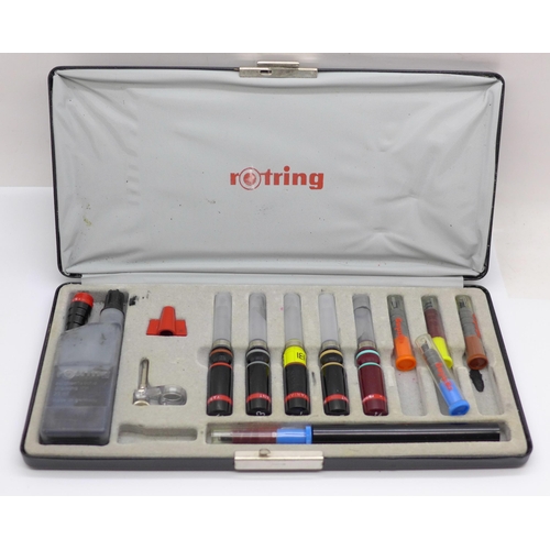 626 - A Rotring drawing pen with various nibs, cased