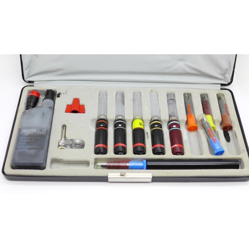 626 - A Rotring drawing pen with various nibs, cased