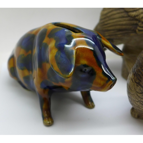 657 - Two Poole pottery owls, the largest signed, a Poole hedgehog and a pig money bank