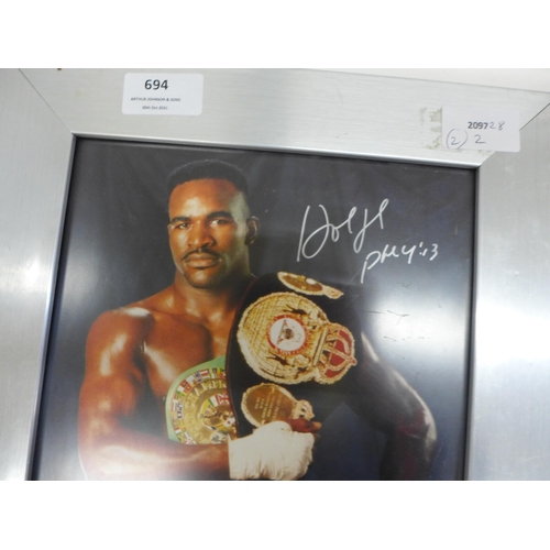 694 - A boxing glove with ten signatures of boxers from 1980's including Frank Bruno and a picture of Evan... 