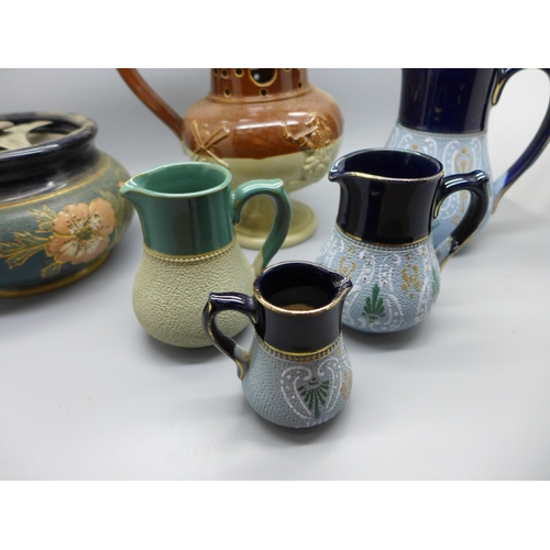 712 - A Bourne Denby puzzle jug, tobacco jar and four Lovatts stoneware jugs