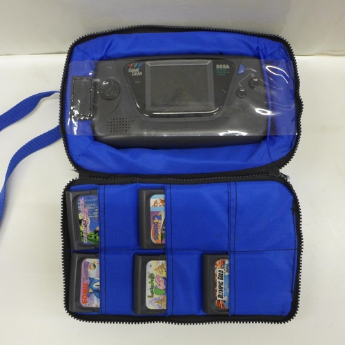 743 - A Sega Game Gear in Logic 3 carry case with five games including Sonic the Hedgehog and Sonic 2