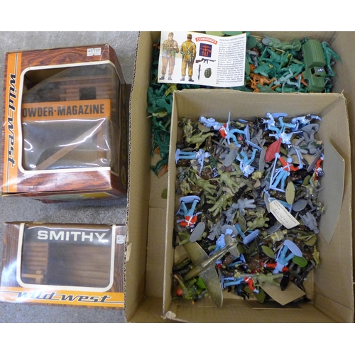 762 - Plastic toy figures and two boxed Hanse Wild West building models, Smithy and Powder magazine