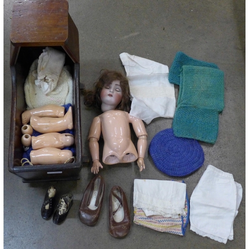 799 - A circa 1900 doll, the head numbered 136/7, clothing and a pair of shoes, and a pair of Little Toddl... 