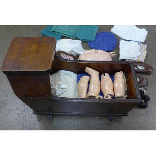 799 - A circa 1900 doll, the head numbered 136/7, clothing and a pair of shoes, and a pair of Little Toddl... 