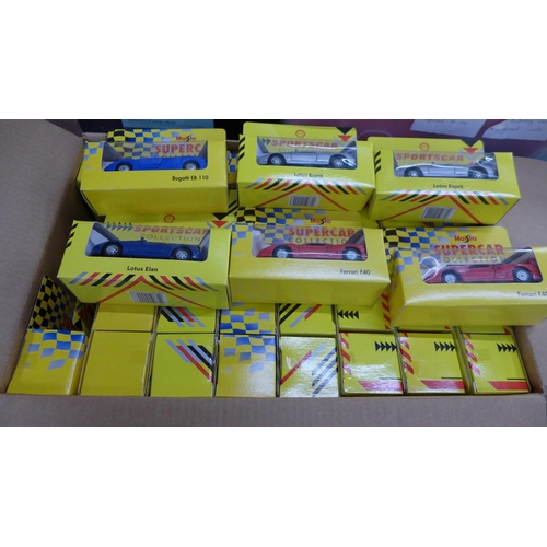 810 - A collection of Maisto, Shell promotional and three Lledo model vehicles, boxed