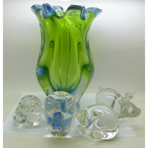 818 - A heavy coloured glass vase and four animal paperweights