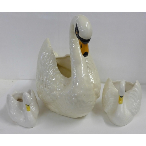 820 - A Dartmouth china swan figure and two Sylvac china swan figures, a/f