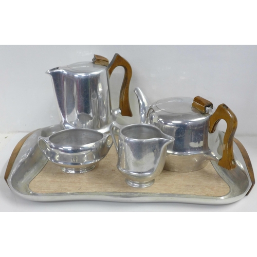 822 - A five piece Picquot ware tea set