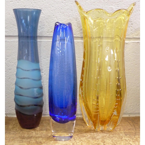 836 - A yellow vase with controlled bubble decoration, a blue glass vase and an indigo vase, tallest 32cm