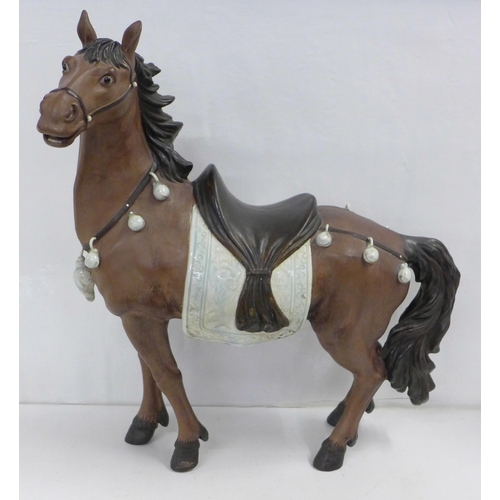 839 - A Chinese pottery horse, marked