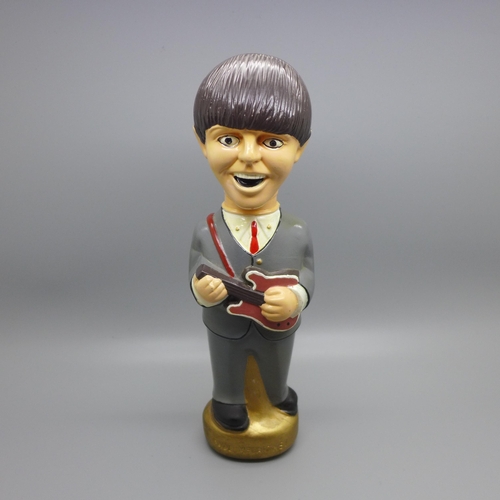 852 - A vintage Beatles Paul McCartney figure, a/f at the base, 23.5cm