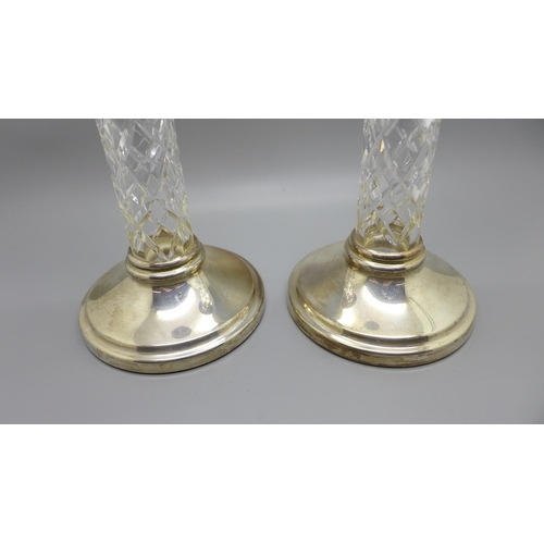 857 - A pair of silver and cut glass candlesticks, 22cm