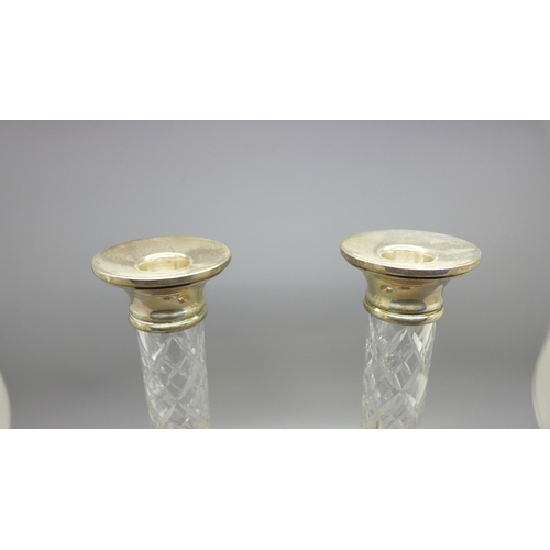 857 - A pair of silver and cut glass candlesticks, 22cm