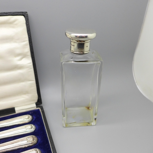 892 - A silver topped glass dressing table bottle and six butter knives