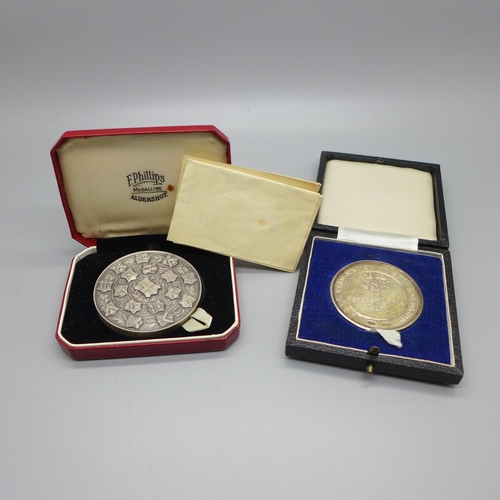 894 - Two silver medallions, 128g