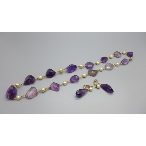 907 - An amethyst and cultured Ciro pearl necklace and a pair of similar clip-on earrings