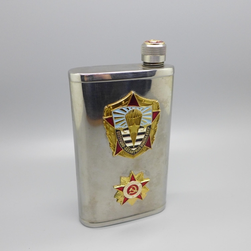 912 - A vintage Soviet spirit flask mounted with two enamel badges