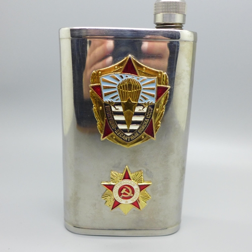 912 - A vintage Soviet spirit flask mounted with two enamel badges