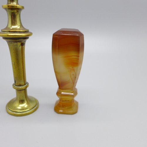 920 - An agate seal, a brass seal with swan finial and three seal fobs