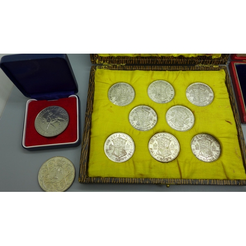 944 - A case with eight 1946 half-crowns, a Queen Victoria commemorative medallion and other coins