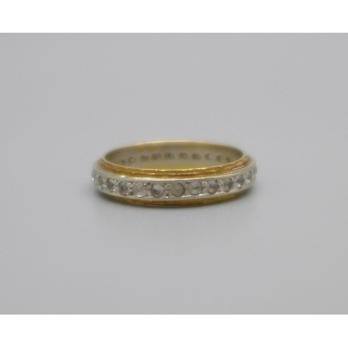 961 - An 18ct gold full eternity ring, set with clear stones, 3.6g, M