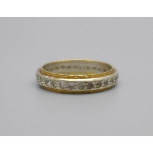 961 - An 18ct gold full eternity ring, set with clear stones, 3.6g, M