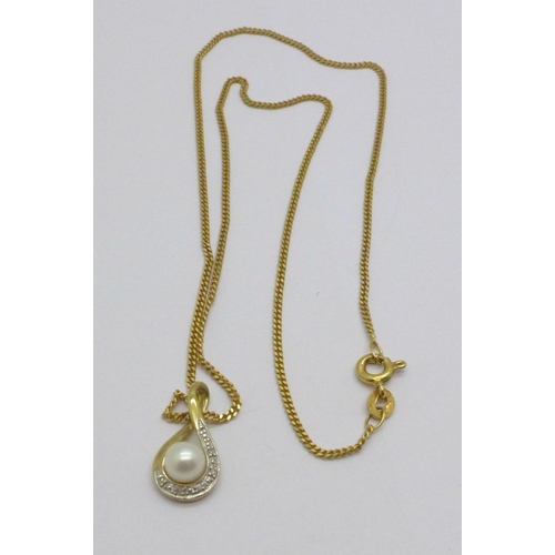 974 - A 9ct gold, diamond and cultured pearl pendant on a 9ct gold chain, 3.3g