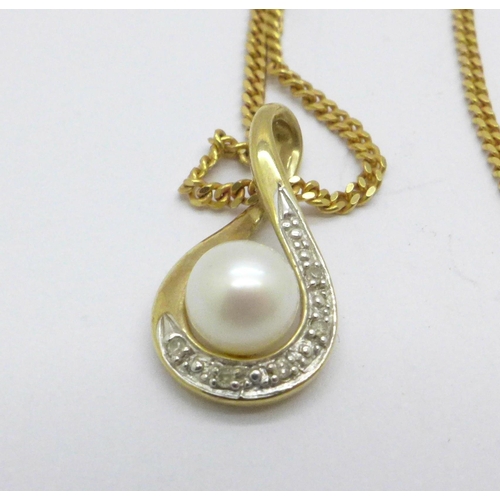 974 - A 9ct gold, diamond and cultured pearl pendant on a 9ct gold chain, 3.3g