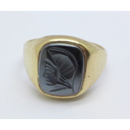 982 - A 9ct gold and hematite intaglio ring, 4.8g, S