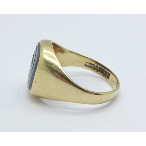 982 - A 9ct gold and hematite intaglio ring, 4.8g, S