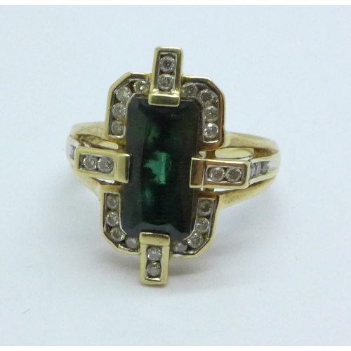 985 - A 9ct gold, diamond and tourmaline ring, 4.9g, N