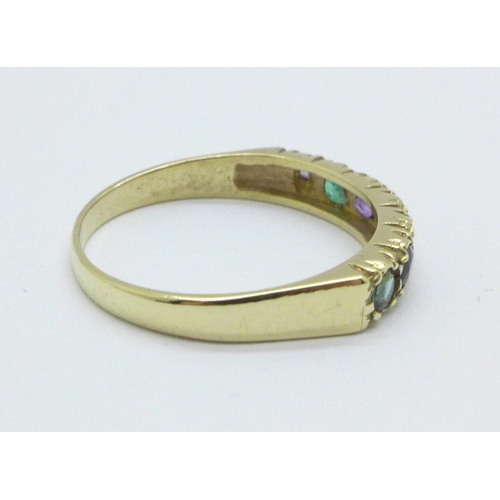 998 - A 9ct gold seven stone ring set with diamond, emerald, sapphire, blue zircon, etc. 1.9g, P