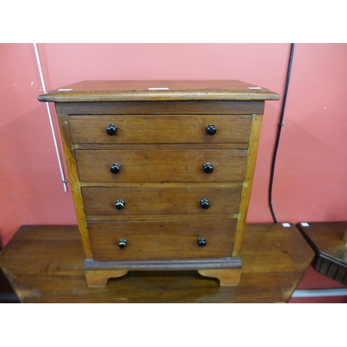 10 - A Victorian oak apprentice's/miniature chest of drawers