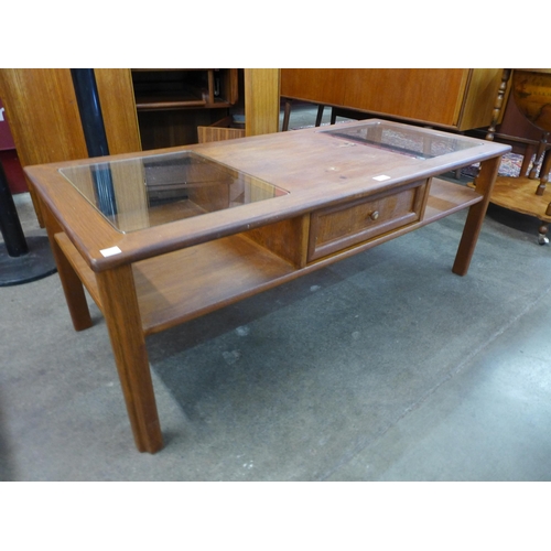 100 - A G-Plan teak and glass topped coffee table