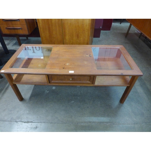 100 - A G-Plan teak and glass topped coffee table