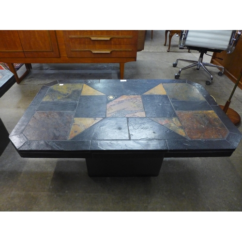 107 - A South African Brutalist slate topped coffee table, in the style of Paul Kingma