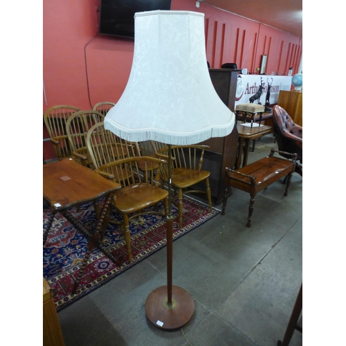 112 - A teak standard lamp