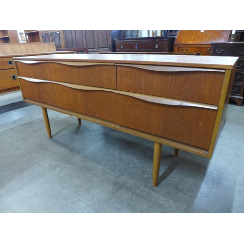 115 - A small teak sideboard