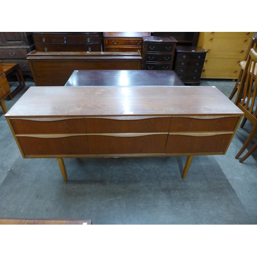 115 - A small teak sideboard