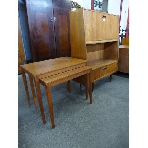 124 - A Danish Bent Silberg teak nest of two tables and a teak cocktail cabinet