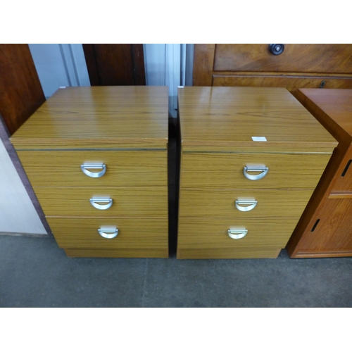 127 - A pair of teak bedside chests