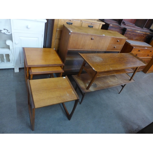 132 - An Avalon teak bookcase, two teak coffee tables, a nest of two tables and another