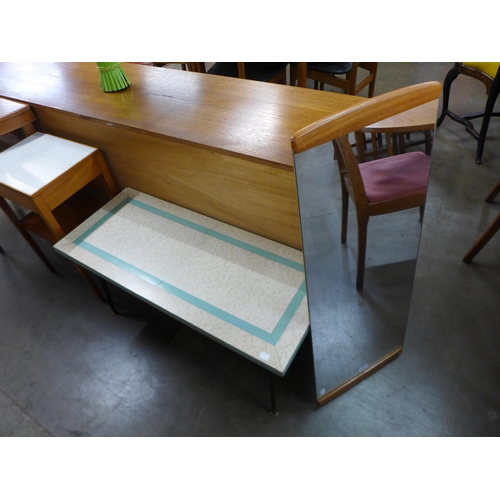 148 - A teak framed mirror and a Formica coffee table