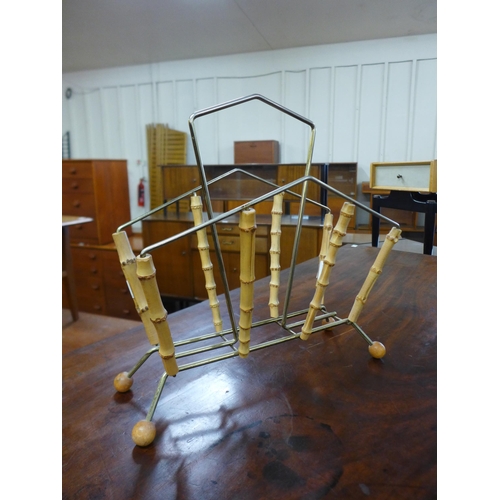 154 - A bamboo and metal magazine rack